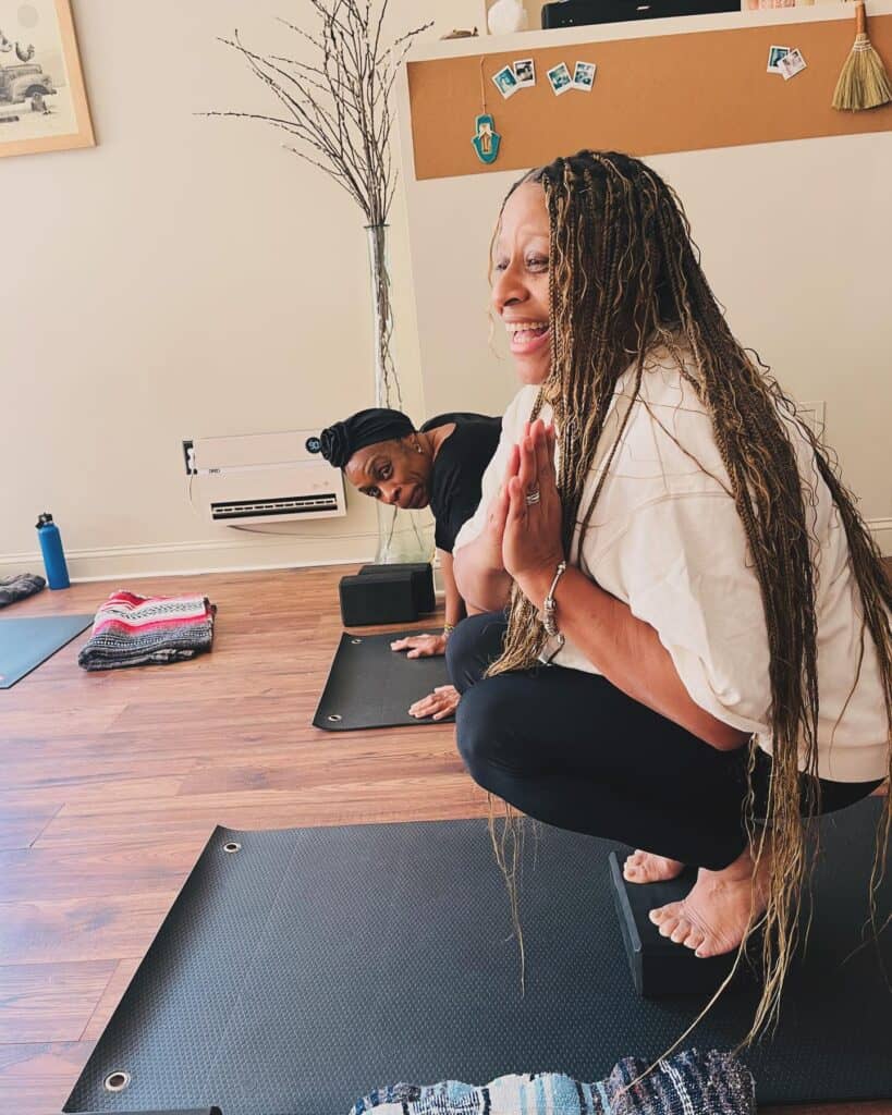 Comfortable women practicing yoga at Bedstuy Yoga studio Brooklyn.