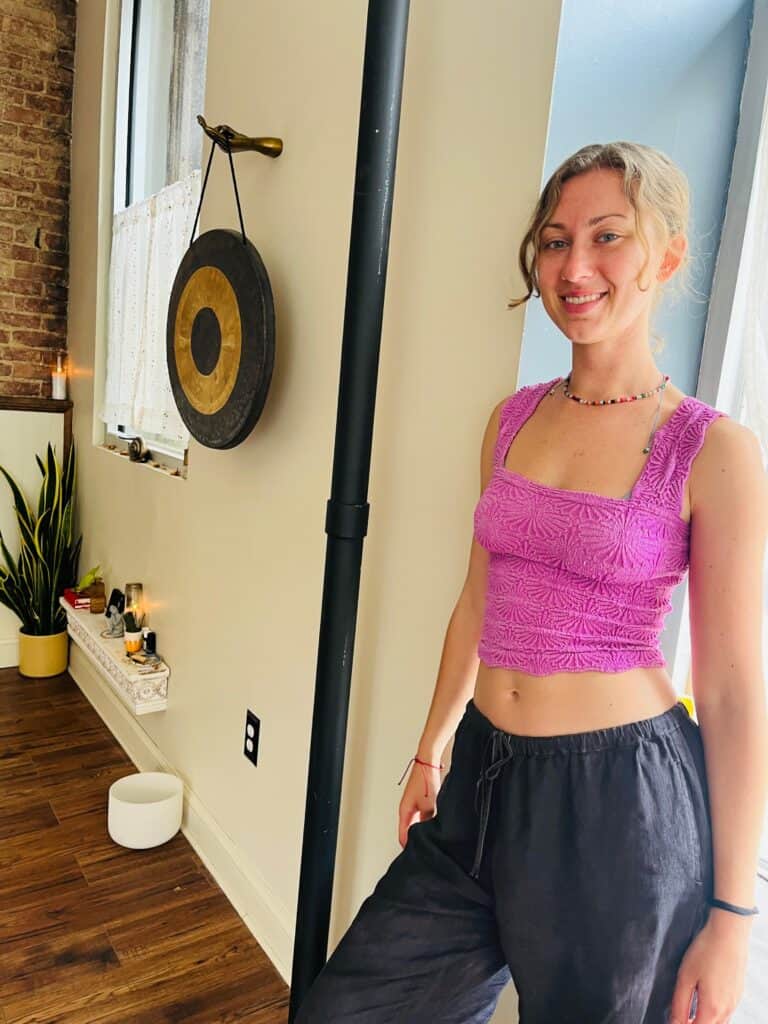 Yoga instructor Julia O'Donnell practicing mindfulness in a serene studio.