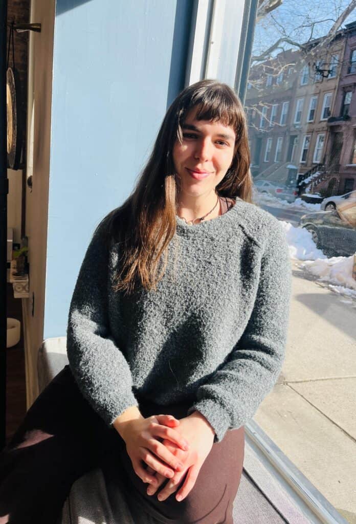 Bright indoor yoga space with large window in Bedstuy, Brooklyn.