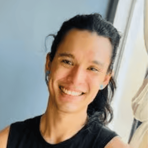 Yoga instructor smiling during a class at Bedstuy Yoga studio.