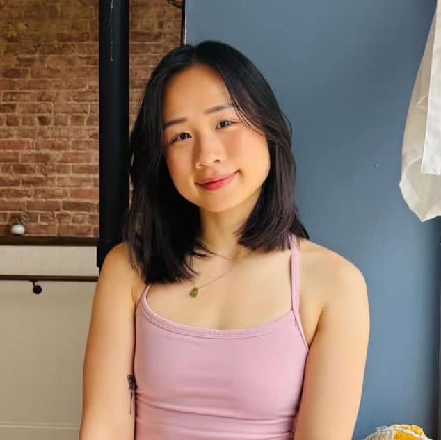 Young woman practicing yoga in a relaxed pose at Bedstuy Yoga studio in Brooklyn.